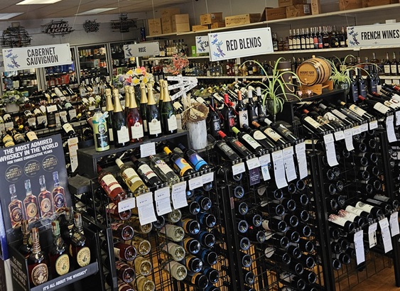 inside Dragonfly Wine & Spirits LLC rows of bottles